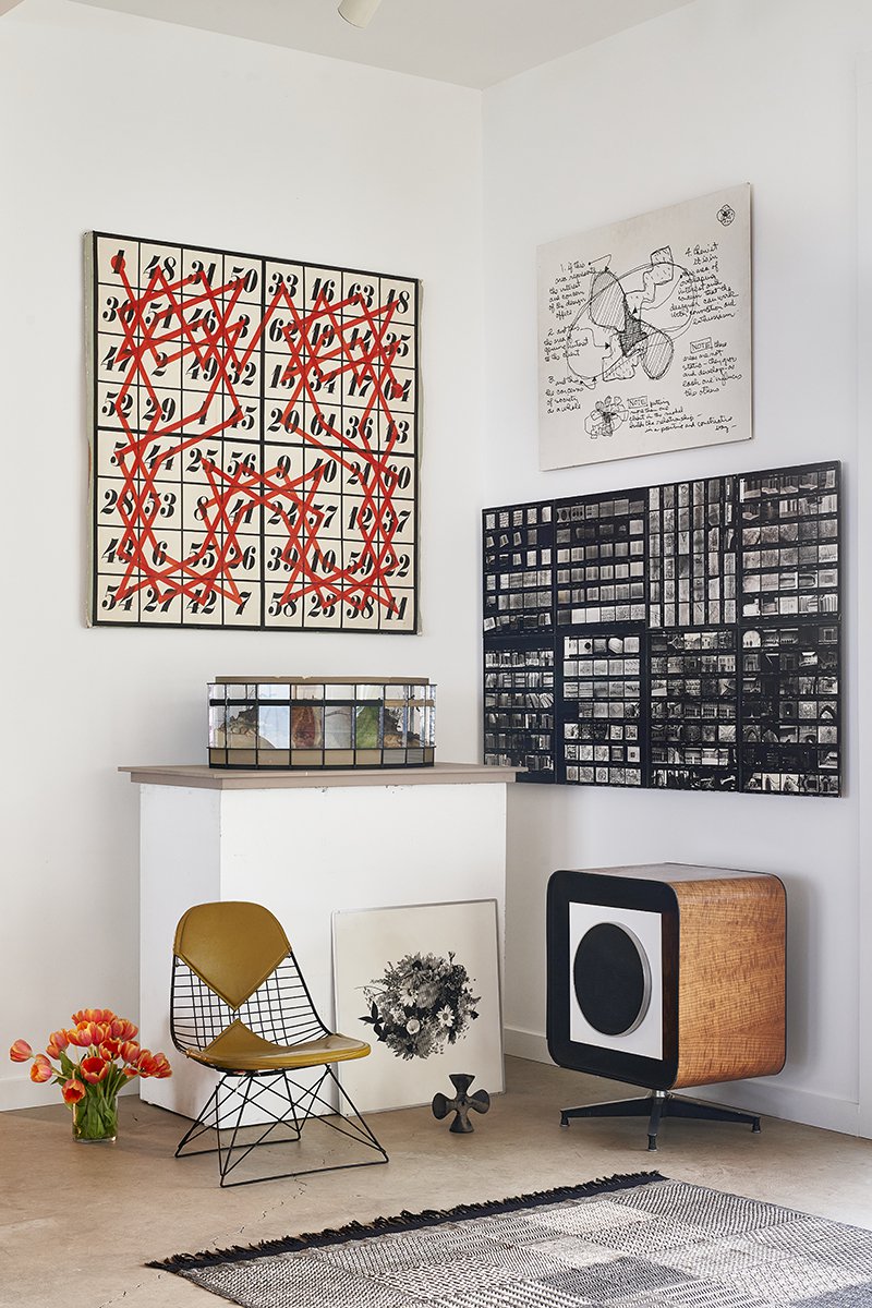 Interior of Eames Ranch showing an image from the Mathematica, the Eames Design Diagram, and a Low K-wire Rod base chair with 2-piece upholstered pad.
