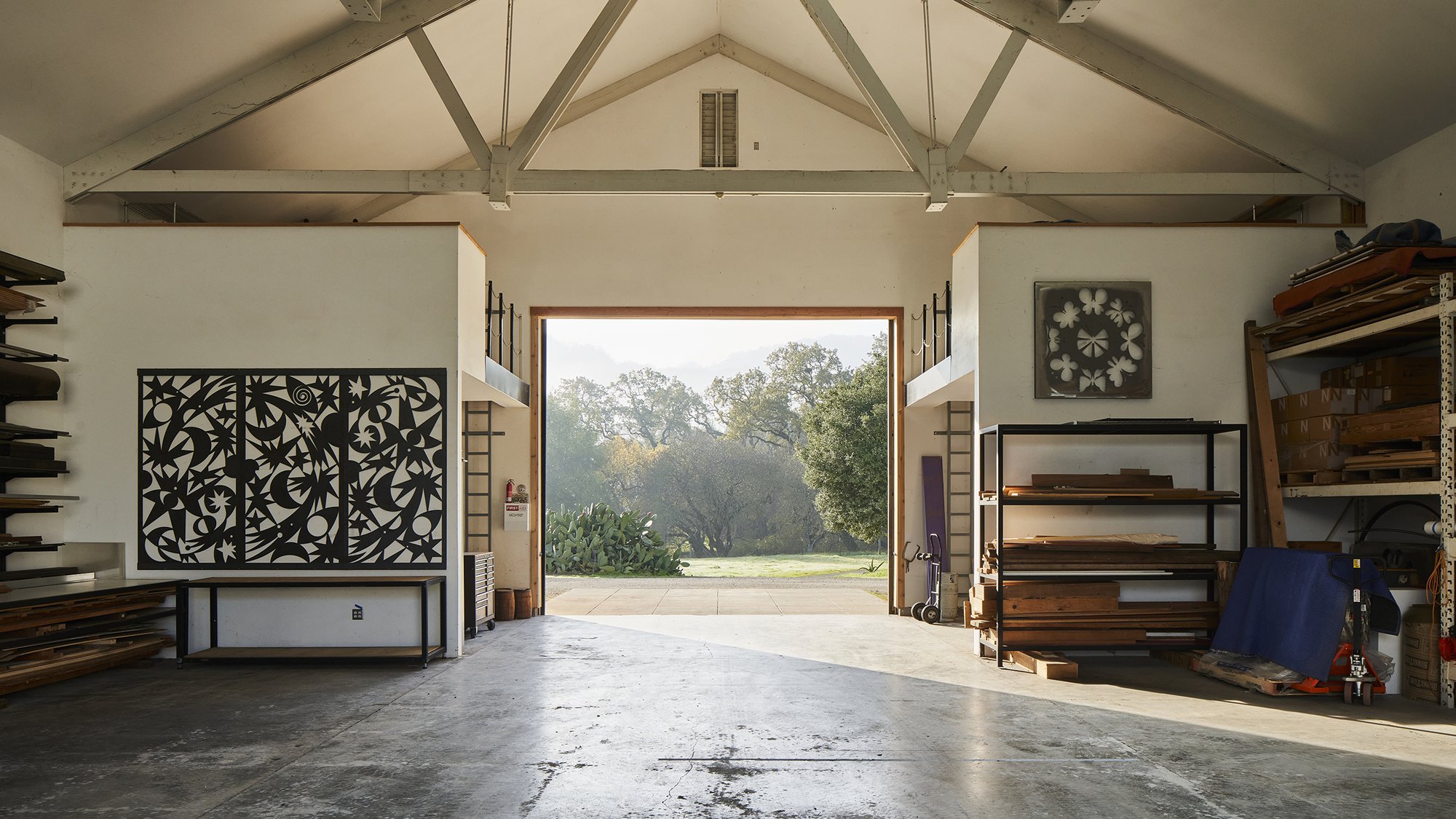 Interior of the woodworking barn at the Eames Ranch. Metal sculptures on the walls were designed by Lucia Eames.