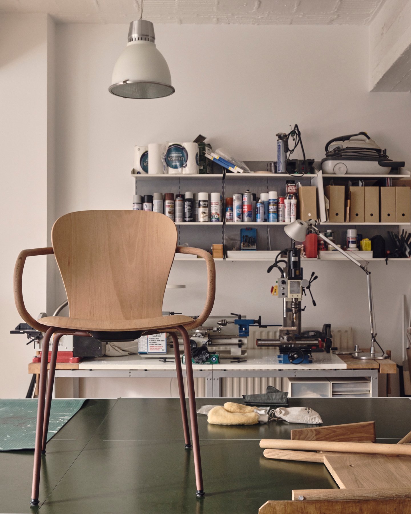 Interior of the London design studio Industrial Facility showcasing a modernist wooden chair—Kazam! Magazine.