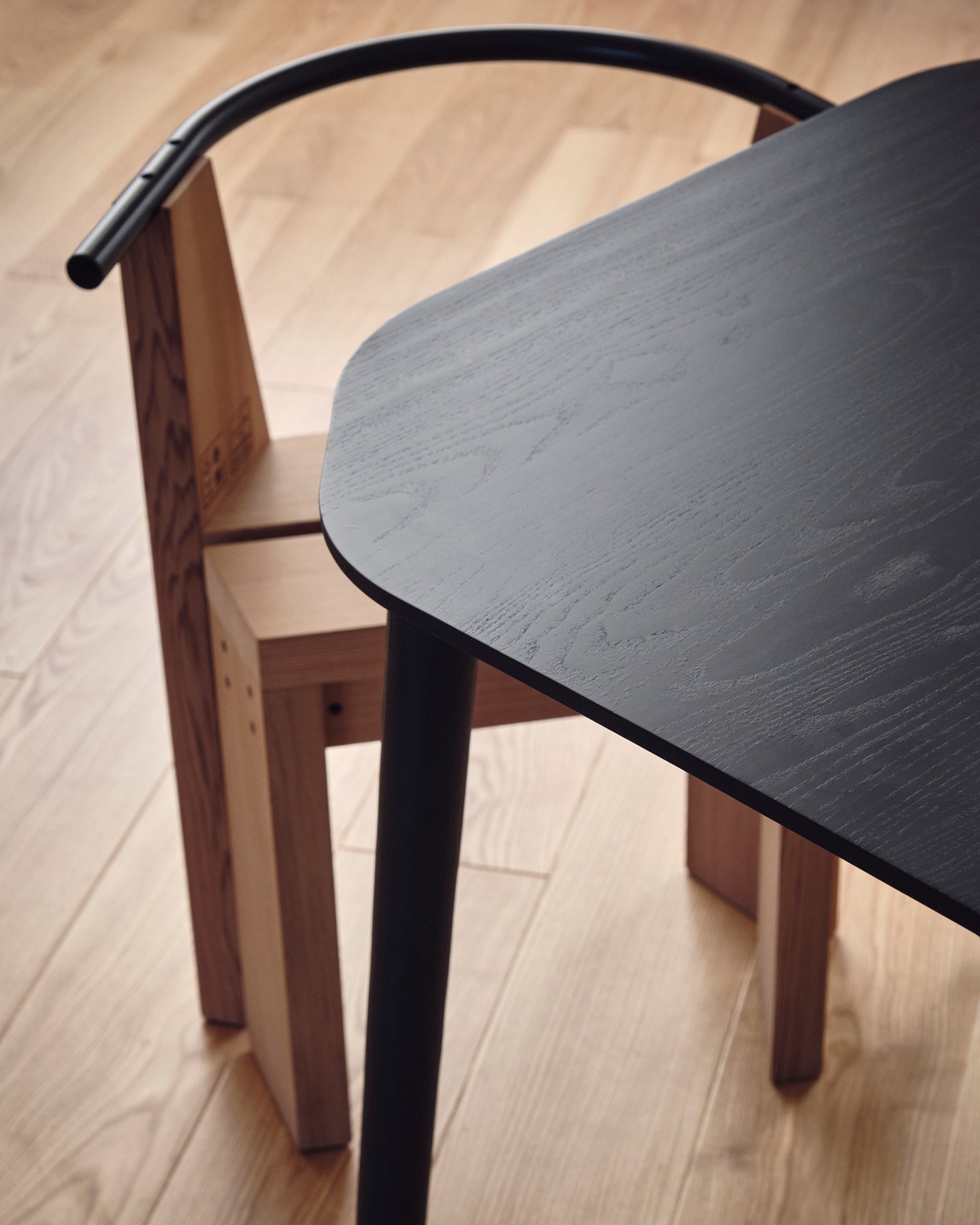 Close up of modernist designed chair and table from design studio Industrial Facility—Kazam! Magazine.