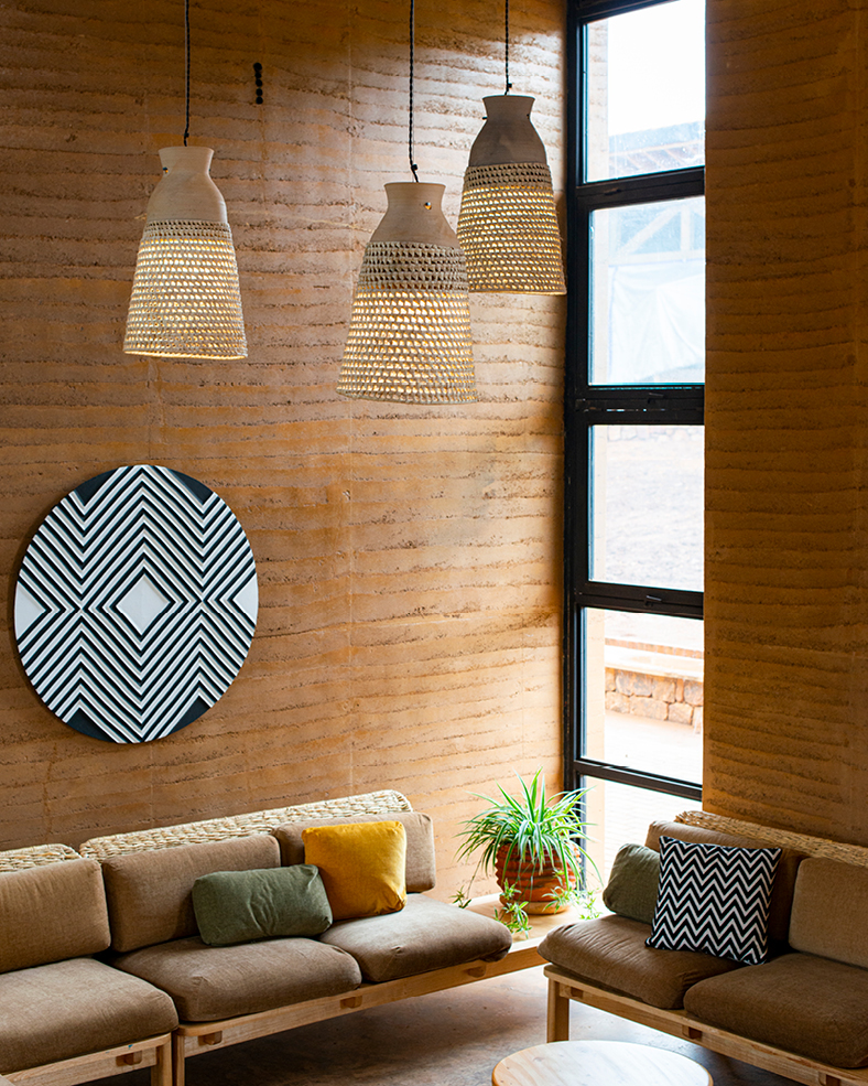 Interior of Rwanda Institute for Conservation Agriculture building decorated with local modern furnishings.