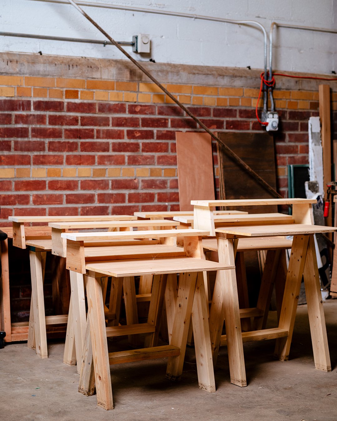 The Brightmoor Maker Space adapted the AA Stool design to desks, which were donated, Kazam! Magazine.
