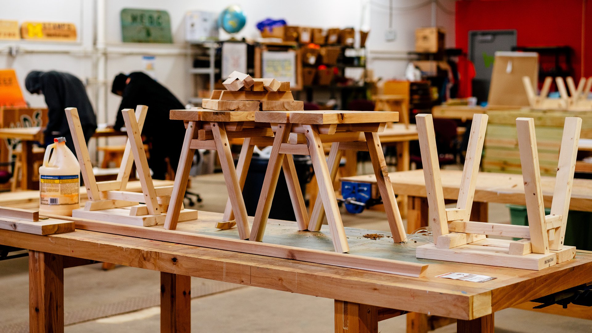 At Brightmoor Maker Space workshop, handmade wooden Ishinomaki benches sit on top of a work table, Kazam! Magazine.