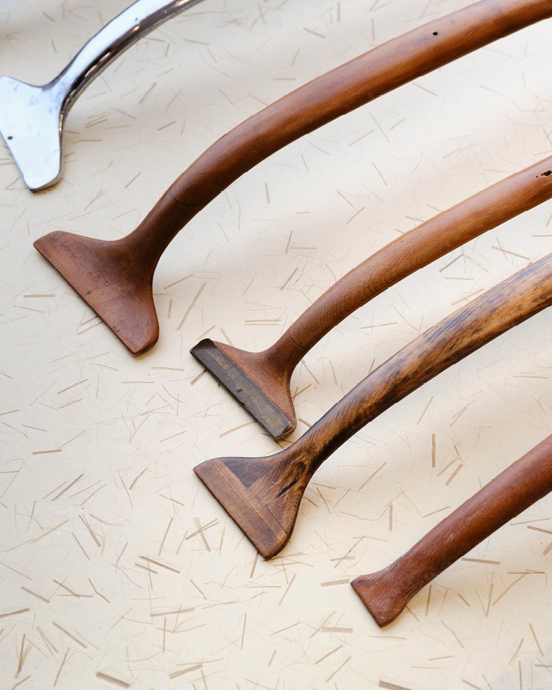 One metal and several hand-carved wooden prototype parts for the Eames Aluminum Group chair base, Kazam! Magazine.