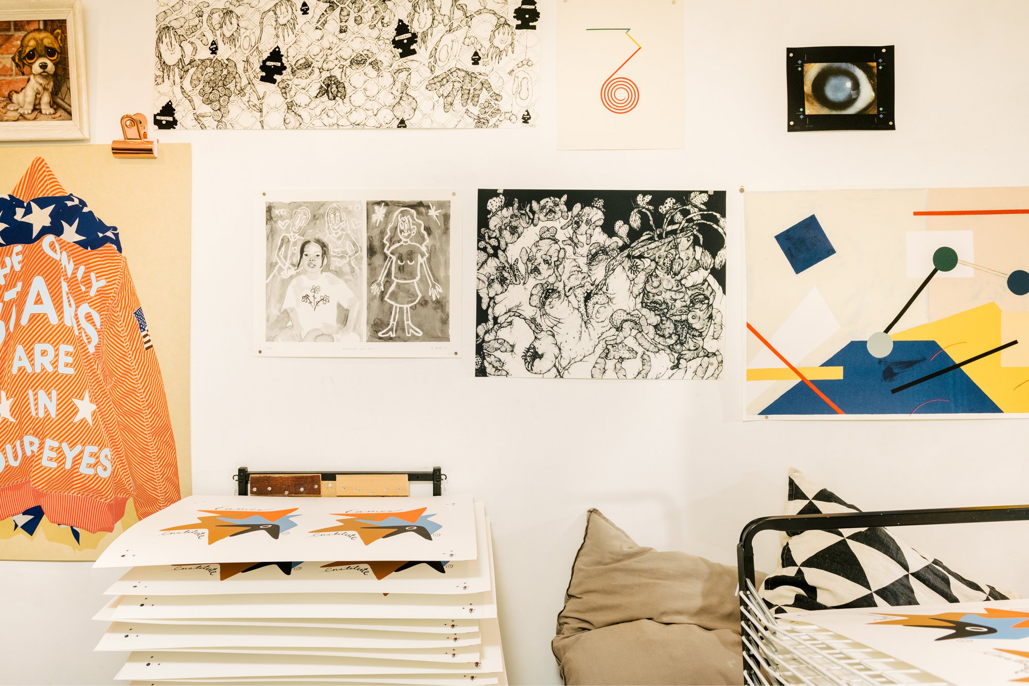 Interior view of Du-Good Press in Brooklyn featuring various prints on the wall.