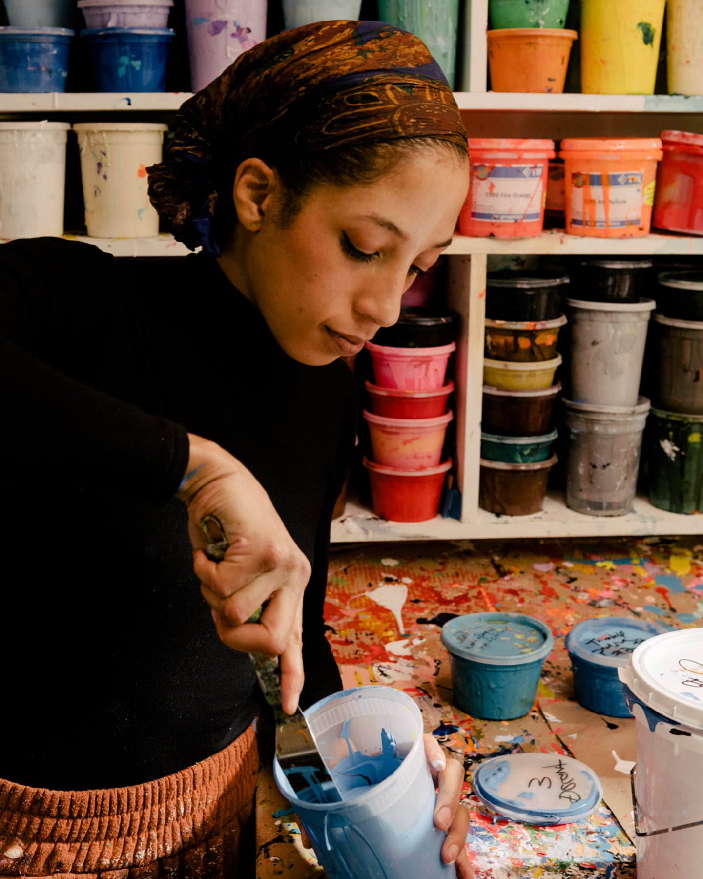Leslie Diuguid, founder of Du-Good Press in Brooklyn, preparing ink for a print.
