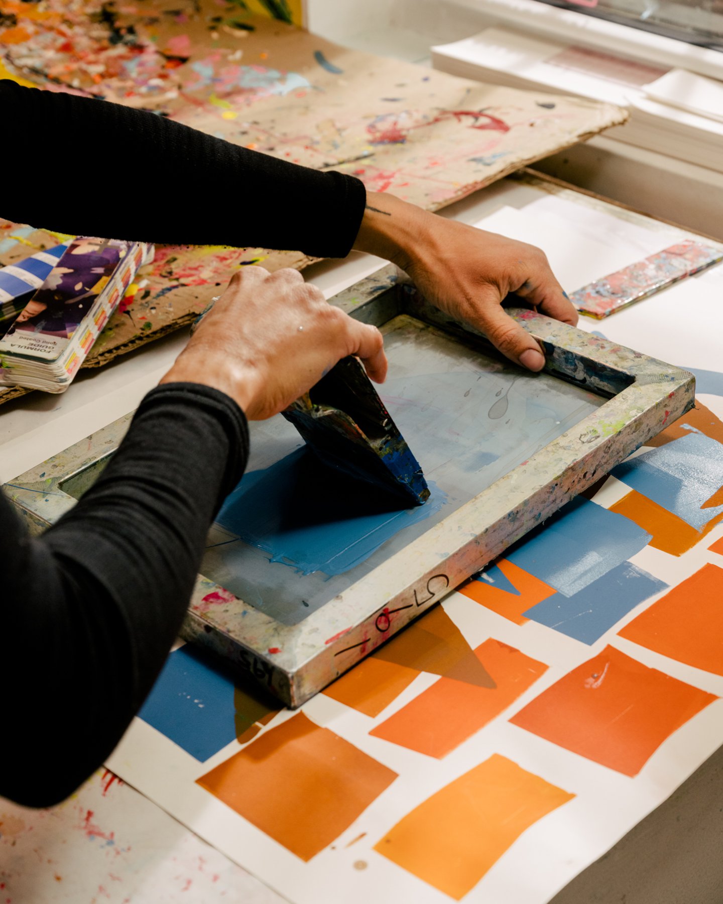 Leslie Diuguid, founder of Du-Good Press in Brooklyn, screen printing in her print shop.