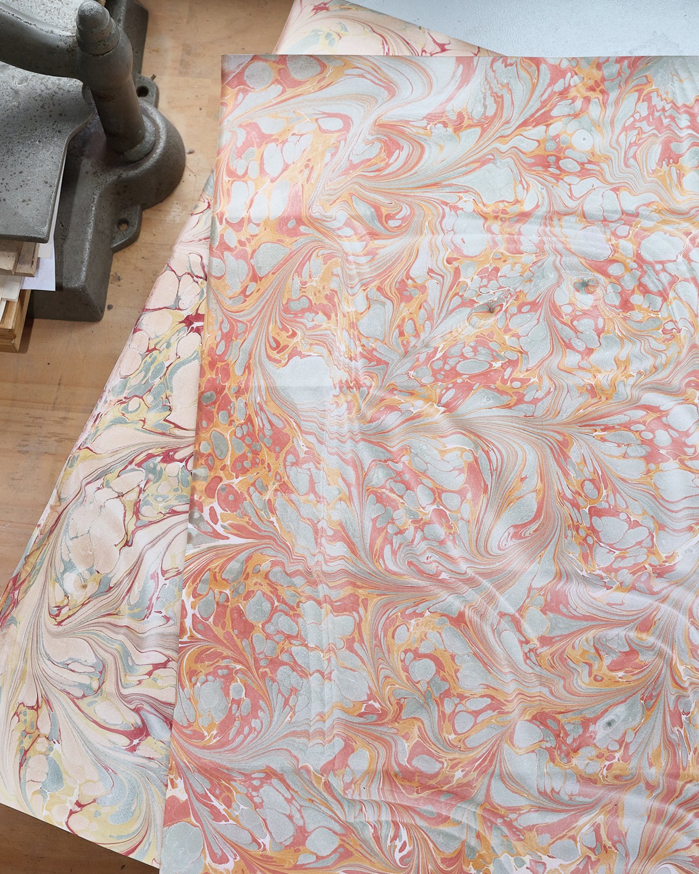Abstract artist Natalie Stopka created the marbling for these papers entirely with handmade watercolors she made from lake pigments, indigo, and chalk.