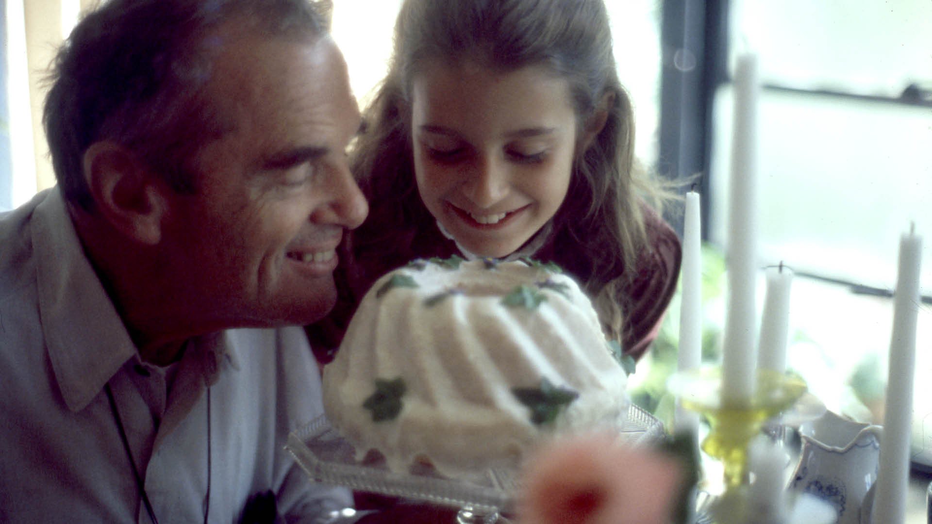A photo of Charles Eames and his granddaughter Llisa Demetrios taken by Ray Eames in November 1976, Kazam! Magazine.