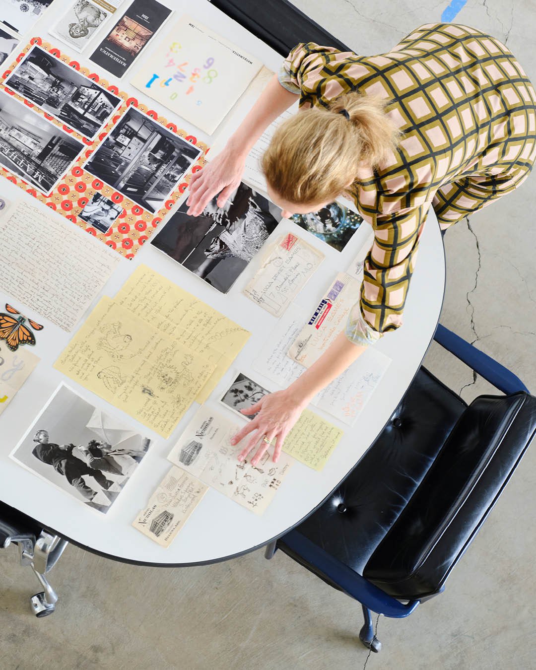 Llisa Demetrios, Chief Curator at the Eames Institute, with the Eameses notes and correspondence from the Eames Collection.