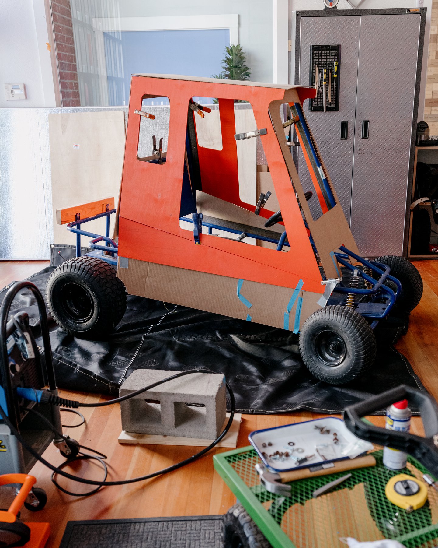 Girls Garage, a workshop and design/build program in Berkeley California, showing an in process image of the derby car that they designed and built for the SFMOMA Soapbox Derby.