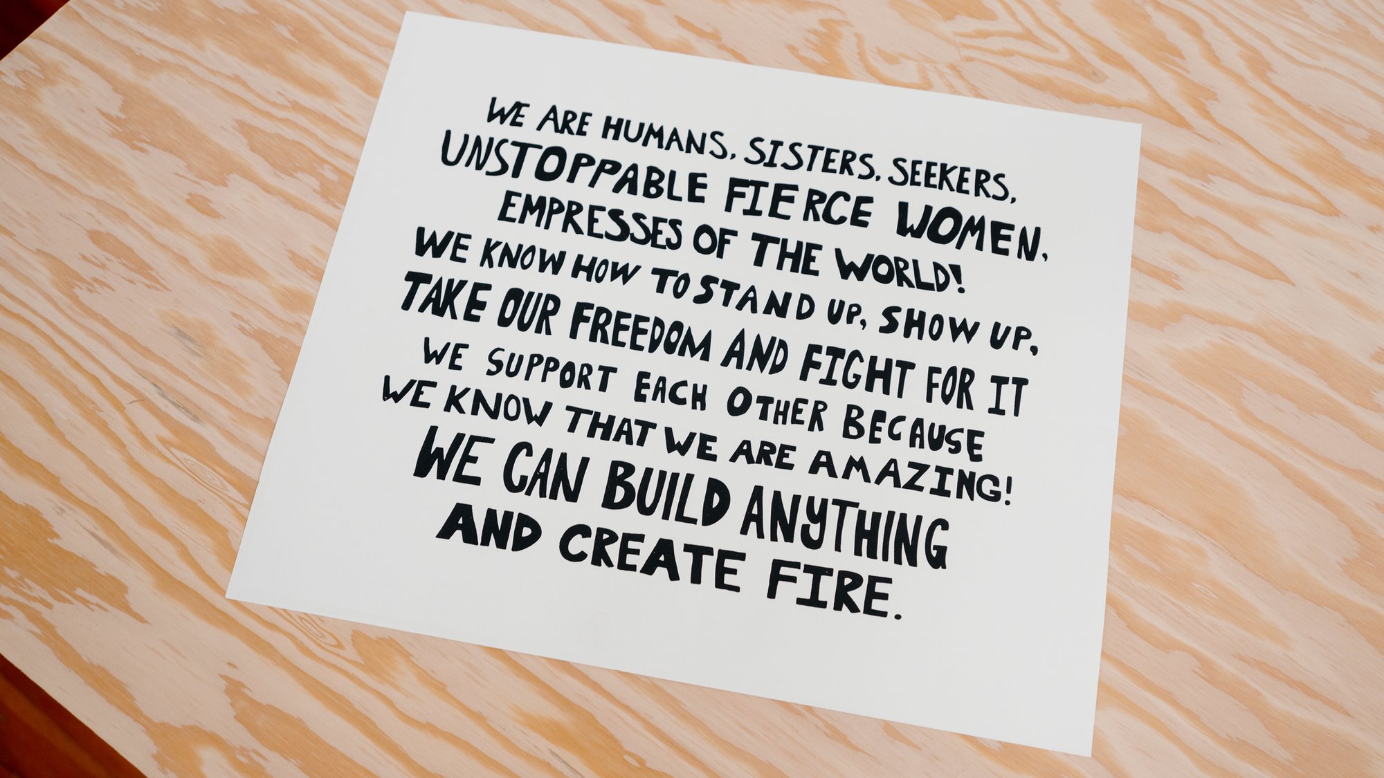 Girls Garage, a design/build workshop in Berkeley California featuring the Womanifesto poster on a worktable.