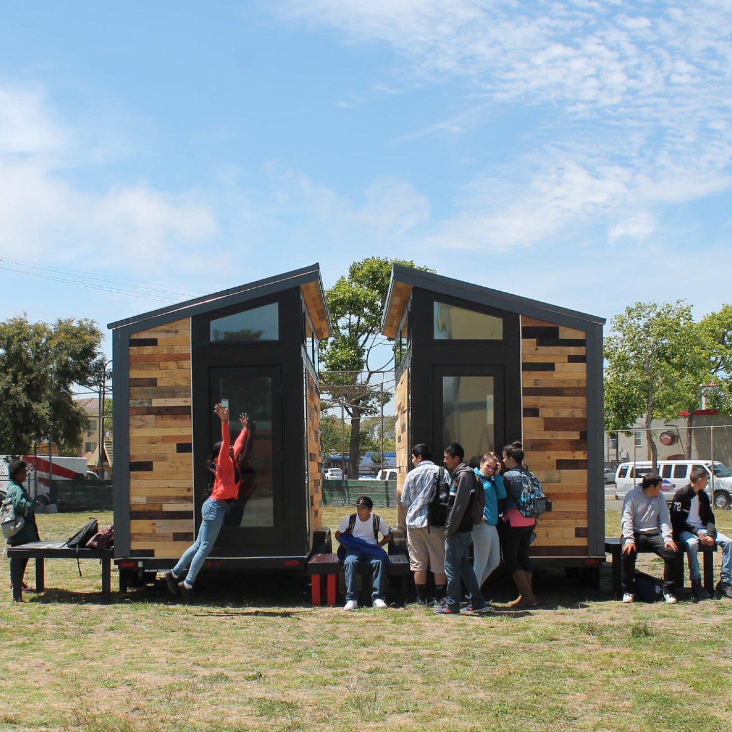 Tiny homes designed by Studio H high school students for a residential center for unhoused citizens.