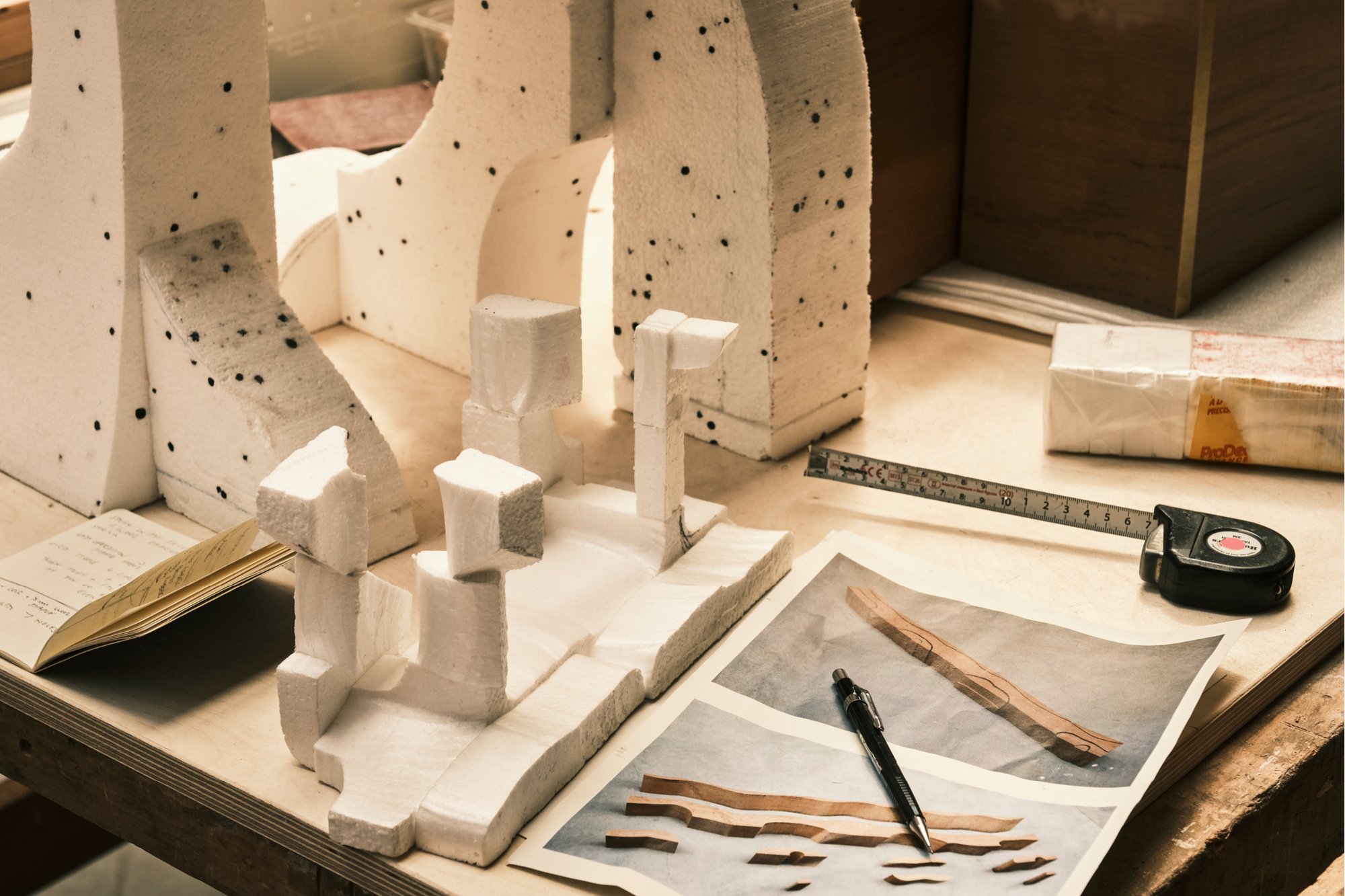 Furniture prototypes on a worktable in Max Lamb's workshop.