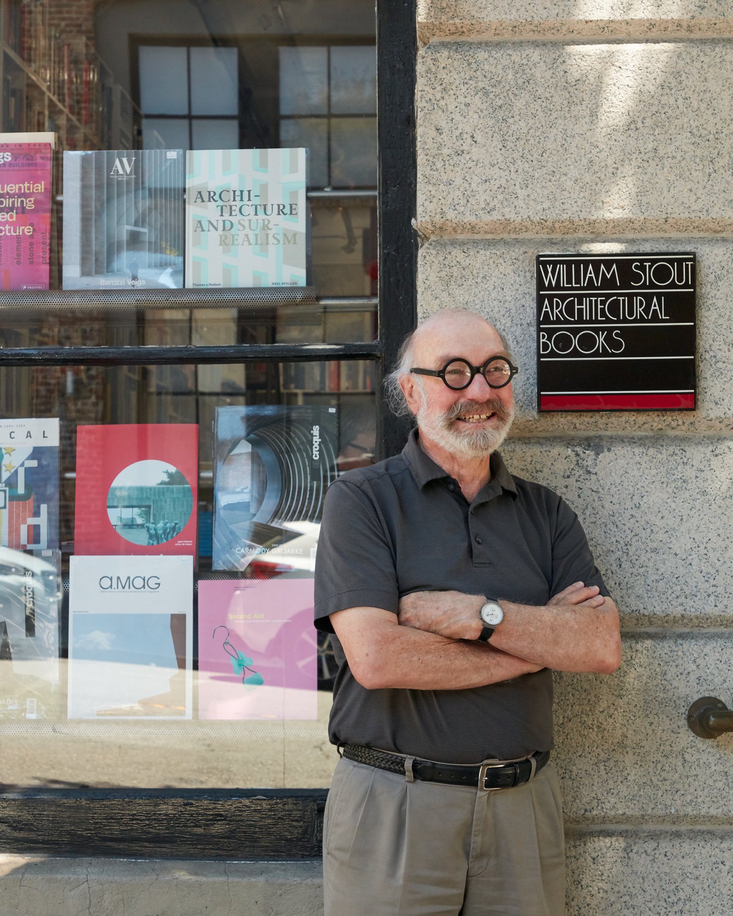 William Stout standing outside the display window of William Stout Architectural Books in San Francisco