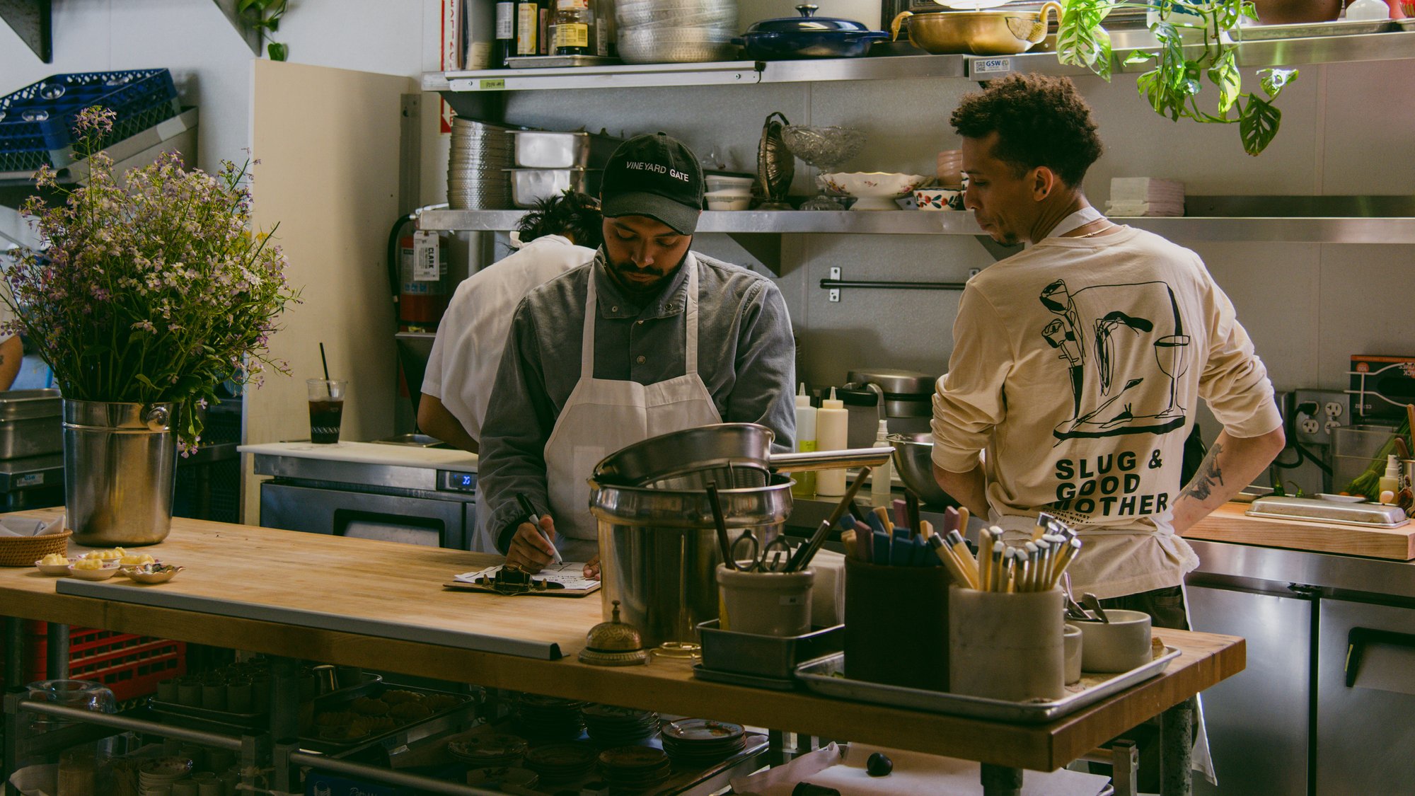 Chef and owner Andres Giraldo Florez at work in the kitchen at Oakland California’s Snail Bar, Kazam! Magazine.